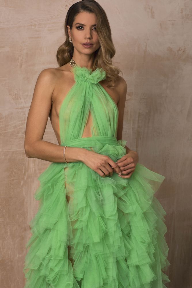 high end ruffle tulle dress in green evening makeup commercial shoot blond wavy hair