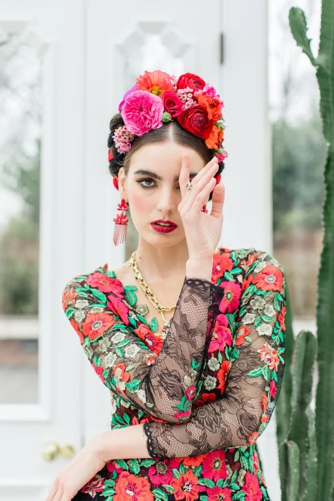 frida kahlo makeup look strong brows red lips flower crown