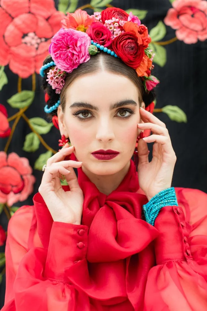 frida kahlo makeup look strong brows red lips flower crown